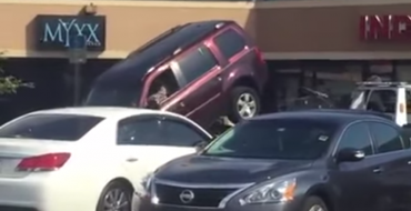 [VIDEO] Florida Man Unsuccessfully Attempts to Drive SUV Off of Tow Truck