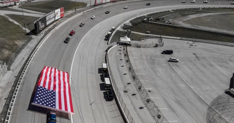 Watch a Chevy Silverado HD Pull a Giant American Flag Around a NASCAR Racetrack [VIDEO]