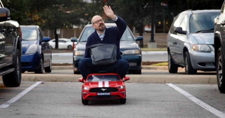 Man Drives Toy Car in Louisiana Education Reform Ad