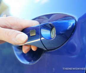 What Is That Tiny Button on the Car Door Handle?