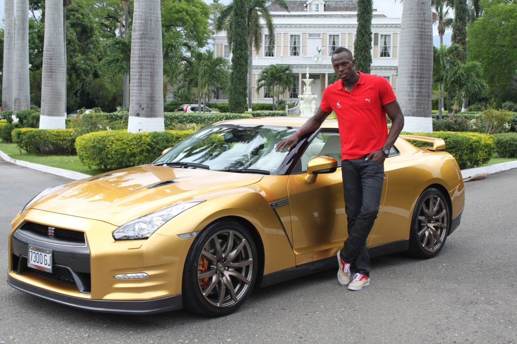 Usain Bolt and his golden Nissan GT-R