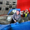 Man getting into Corvette Corvettes Being Pulled