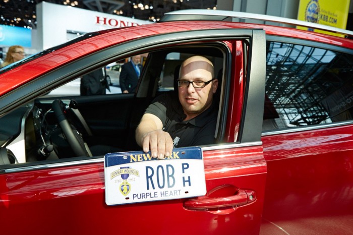 Robert Loria in his RAV4 with Rob Purple Heart license