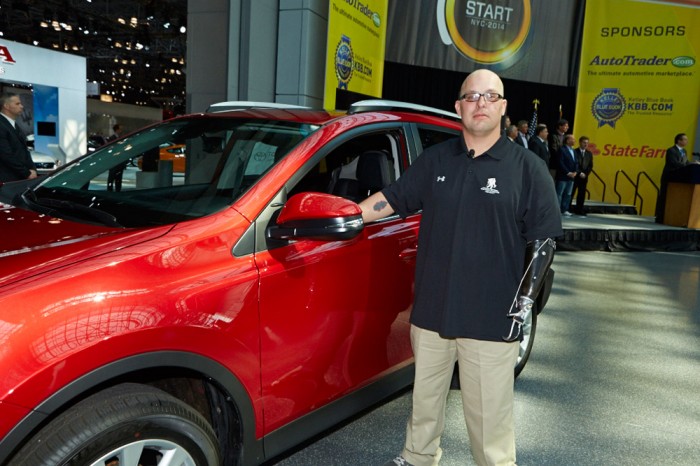 Specialist Robert Loria next to his 2014 RAV4