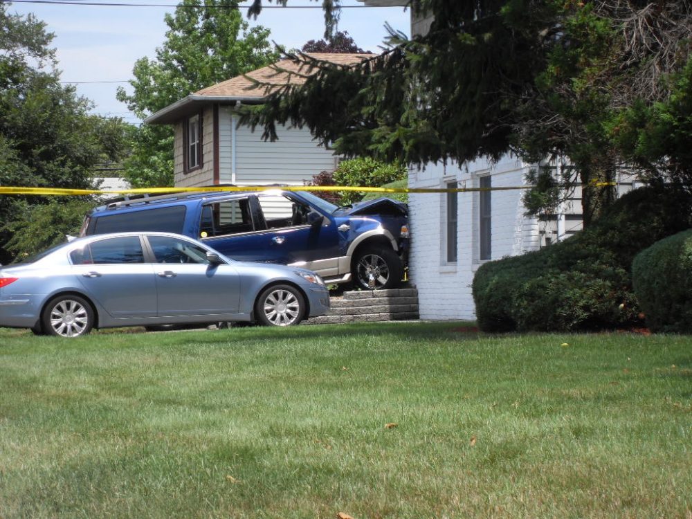 car crashes into house