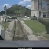 Driver escapes train