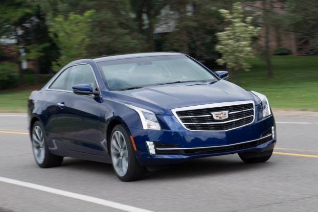 2015-Cadillac-ATScoupe-blue-front-driving-suburb-road