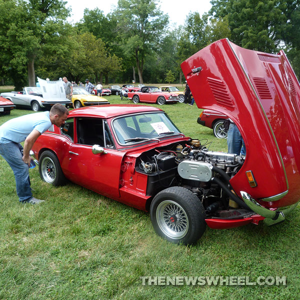 Man looking in car at Dayton British Car Day