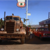 Mann's Plymouth Valiant, overshadowed by the massive truck