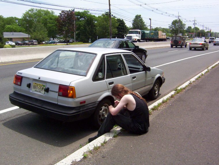 Reconsider Buying Your Teen a Used Car male grey sedan broken down car