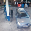 woman can't find gas cap