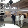 From left to right, Ohio Governor John Kasich and Honda executives Tom Shoupe and Rick Schostek admire an Accord V6 engine and transmission at the new Honda museum in Ohio.