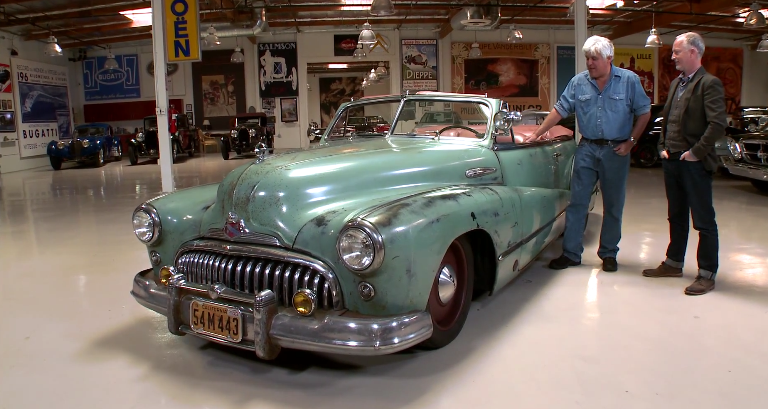 Jay Leno and Jonathan Ward examine a souped-up 1948 Buick Super Convertible