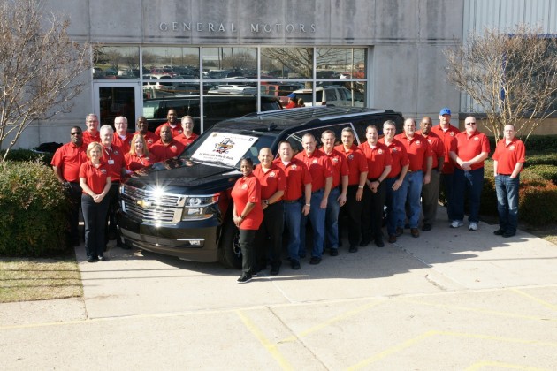 Employees at the GM Arlington Assembly Center gather around the plant's 10 millionth vehicle, a 2015 Chevy Suburban