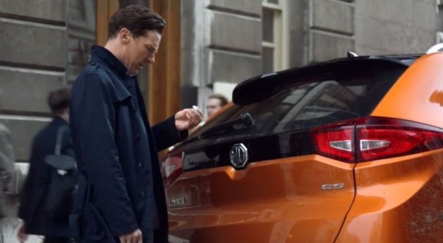 Benedict Cumberbatch as Sherlock Holmes persona in Chinese MG Cars ad inspecting orange MG GS