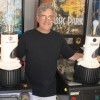 Bob Gale poses with two of the world's four Mr. Fusion lamps