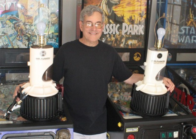 Bob Gale poses with two of the world's four Mr. Fusion lamps