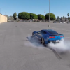 A Blue Laguna C7 Corvette's burnout is captured by a flying drone camera