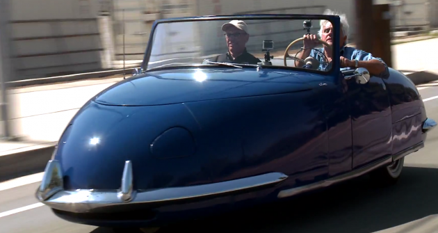 Jay Leno (right) and Peterson Museum curator  Leslie Kendall take a '48 Davin out for a spin