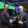 Stephen Odell, Ford executive vice president, global marketing and sales, receives the trophy for Best Overall Truck Brand in the 2015 Kelley Blue Book Brand Image Awards from Kelley Blue Book President Steve Lind