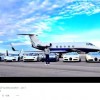 Mayweather poses in front of his personal jet and eight exotic vehicles.