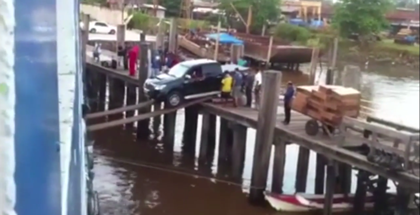 car boarding a ship over a plank