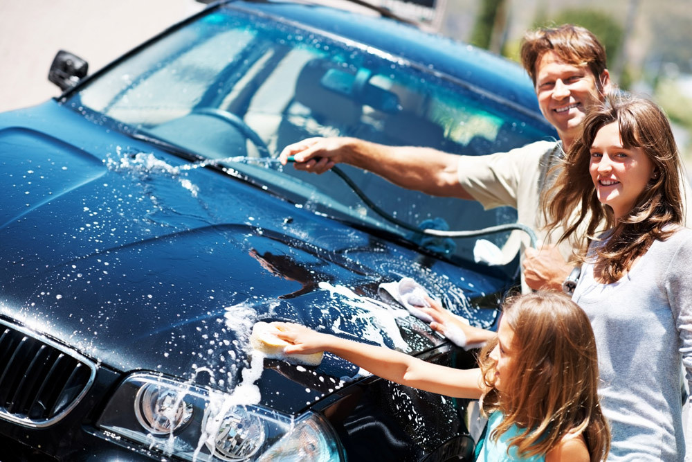 happy people car wash together outside