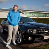 Manchester United player Wayne Rooney, looking positively thrilled with his new Camaro convertible