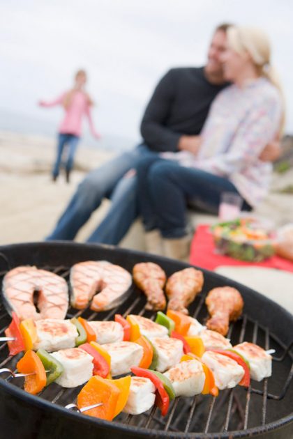 Couple Cooking on a Barbecue