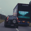 A Honda CR-V passes the high-tech Samsung Safety Truck on an Argentinian highway