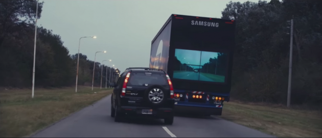 A Honda CR-V passes the high-tech Samsung Safety Truck on an Argentinian highway