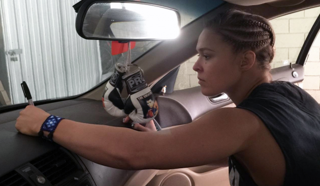 Ronda Roussey signs her old 2005 Honda Accord LX