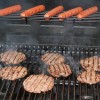 how to properly tailgate - grilling up burgers and hot dogs