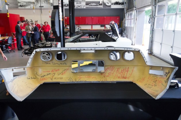 GM technicians work to restore the badly damaged 1992 C4 Corvette convertible