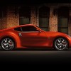 2016-nissan-370Z-coupe-magma-red-brick-wall-side-view-large