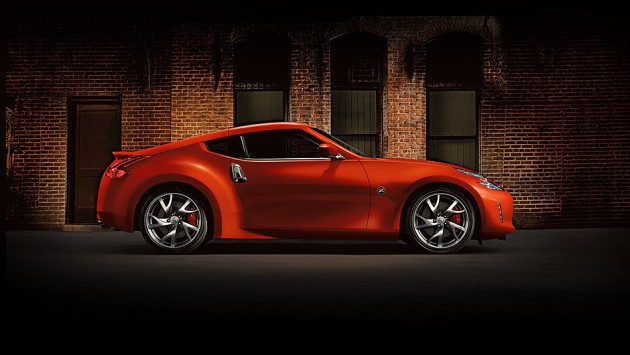 2016-nissan-370Z-coupe-magma-red-brick-wall-side-view-large