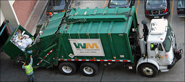 green garbage truck powered by natural gas