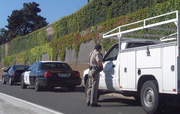 Usually, the person inside the vehicle asks, "What seems to be the issue, Officer?"Image: Coolcaesar