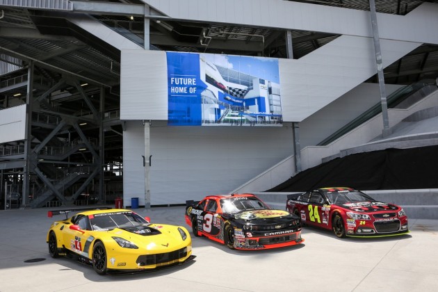 A Corvette C7.R, NASCAR Xfinity Series Chevrolet Camaro, and NASCAR Sprint Cup Chevrolet SS parked in front of the future home of Daytona's Chevrolet entrance