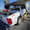 2015 Chevy Colorado pickup truck being loaded onto airplane in Alaska