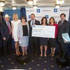 GM representatives present grant money totaling $1 million at the National Press Club