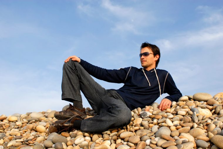 Man lounging on rocks