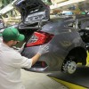 Honda of Canada Mfg. associates install a rear bumper fascia on a 2016 Civic Honda Civic Sedan.