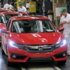 Honda of Canada Mfg. associates perform final inspections on an all-new 2016 Honda Civic Sedan as it rolls off the assembly line.
