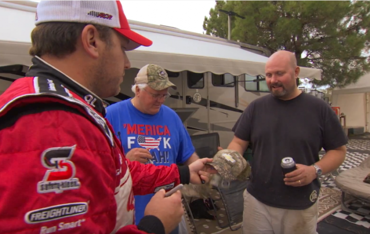 NASCAR driver Ryan Newman autographs hat for Chevy Silverado owner