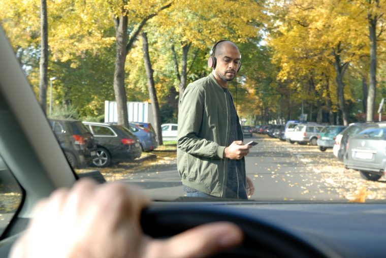 Crosswalk accident with pedestrian. Man with smartphone and