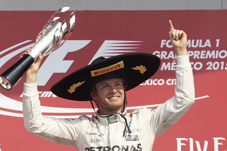 Rosberg holding his trophy