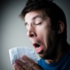 man sneezing cold tissue