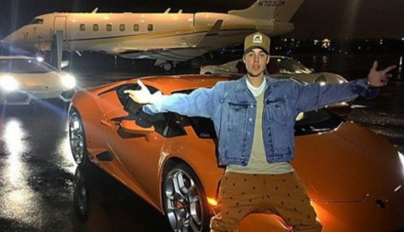 [Image: Biebers-jet-and-orange-Lamborghini.png]