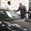 Fred Payne (left), business division manager at Honda Manufacturing of Indiana, greets Indiana Governor Mike Pence at a news conference today announcing a million investment at the Greensburg plant.